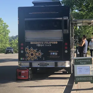 people getting food from the truck