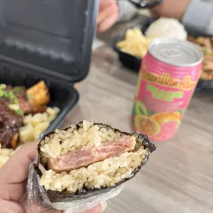 a hand holding a piece of food