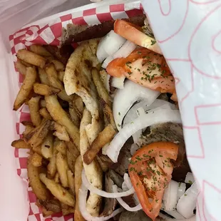 Gyro Platter. Not sure how much it cost as we bought alot. But loads of fries. 2 pitas