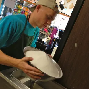 adding sugar to make ice cream mix