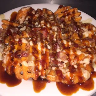 Waffle battered sweet potato fries with bacon, siracha bourbon and donut glaze
