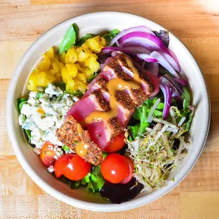 Yellowfin Tuna in a bowl with a bunch of fresh vegetables