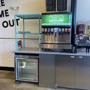 a counter with a soda machine
