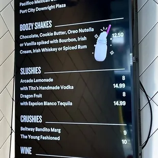 Menu sign board (Dec 2023) - zoom in for details and prices. A fast food+ burger joint with beer wine and booze say what?! :)