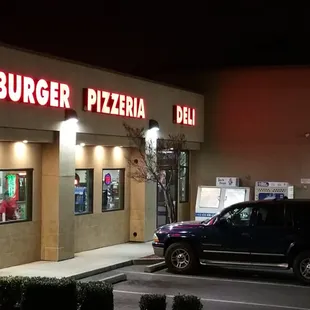 the front of a restaurant at night