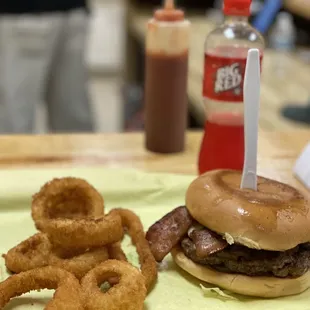 a hamburger and onion rings