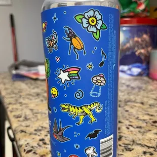 a can with stickers on it