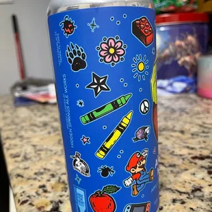 a blue can with stickers on it