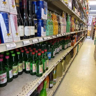 a wide aisle of liquor bottles