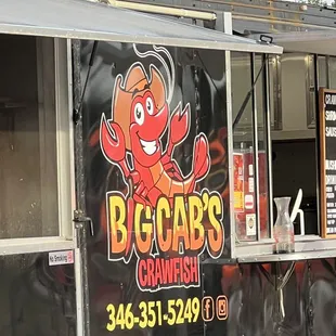 a lobster on the side of a food truck