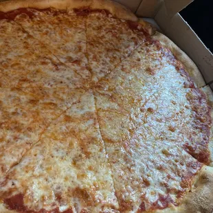 A cheese pizza from mikes up the street to show you how a pizza is suppose to look.