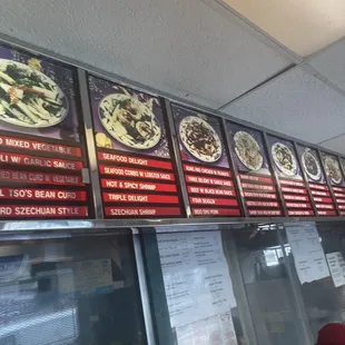 menus on the wall of a restaurant