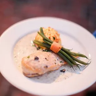 Chicken Chablis served with Whipped Duchess Potatoes &amp; Haricot Vert with Carrot