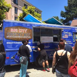 At the Cherry  Festival in San Leandro hiding in the back of Casa Peralta house museum courtyard.