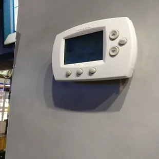 Thermostat reads 88 degrees on the left if you zoom in.  A/C must be out.