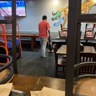 Sweeping while I eat. RUDE!!!