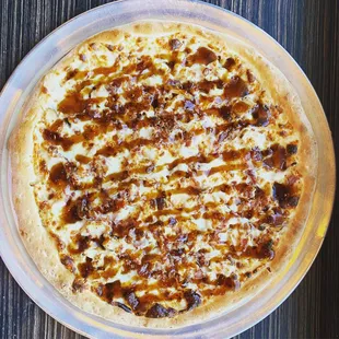 a cheese and bacon pizza