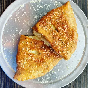 two pieces of pizza on a plate