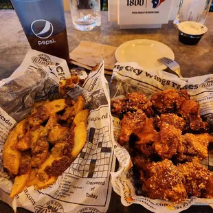 Hot wings with chili cheese potato wedges.