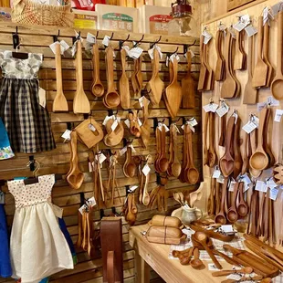 a display of wooden spoons and utensils