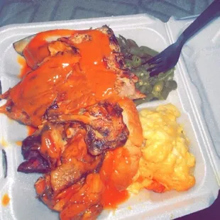 Combo dinner, chicken and ribs with Mac and green beans with their house fruit punch ‍  Combo Dinner Mac &amp; Cheese Green Beans