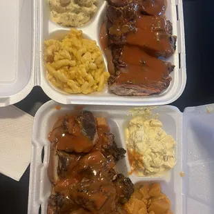 Chicken dinner and rib dinner with yams, potato salad and mac and cheese.