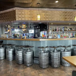 a row of beer kegs