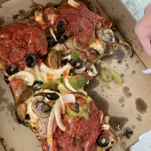 a slice of pizza in a box