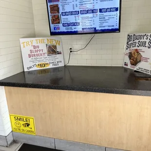 a counter with a menu on it