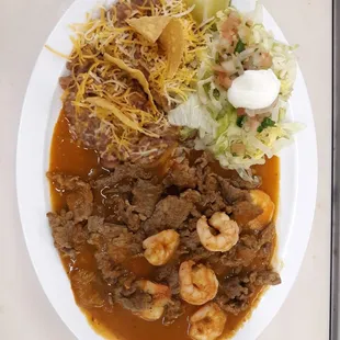 This is our steak &amp;shrimp plate with tortillas and the salad