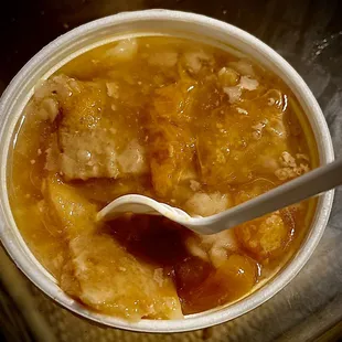 A delicious warm peach cobbler.