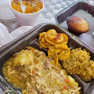 Shredded turkey and gravy over mashed potatoes, rice and broccoli casserole and summer squash