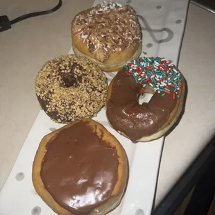 Boston Cream, Peanut Chocolate, Chocolate Iced with Sprinkles, Toasted Coconut