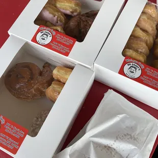 three boxes of doughnuts