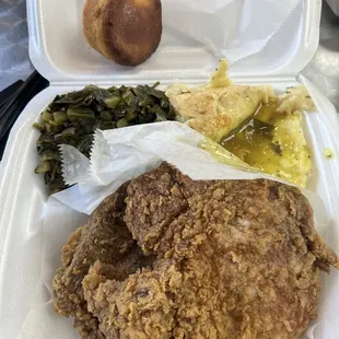 2 Fried pork chops, mashed potatoes with chicken gravy, collard greens, and cornbread