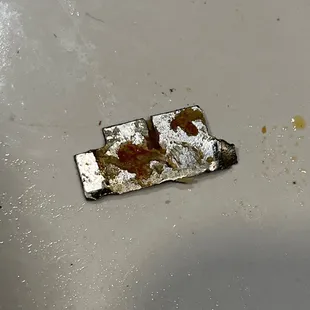 a burnt piece of pizza