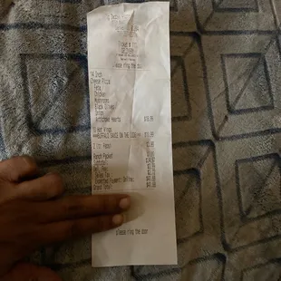 a person holding a receipt