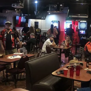 a large group of people sitting at tables