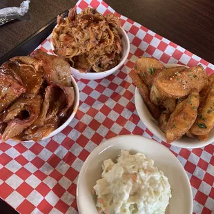 Brisket, pulled pork, potato wedges and slaw