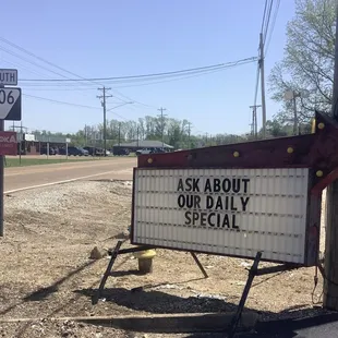 a sign that says ask about our daily special