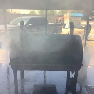 smoke coming out of the grill