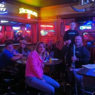 a group of people sitting at a table