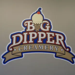 Big logo display on the wall.