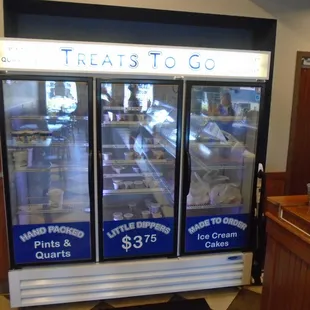 To-go ice cream cooler on the back wall.