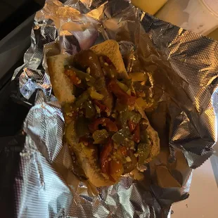 a hot dog with toppings