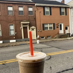 a person holding a cup of coffee