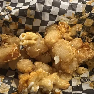 Tator tots with Mac and cheese and bbq sauce