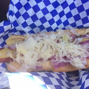 a hot dog with onions and cheese