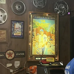 a man standing in front of a poster