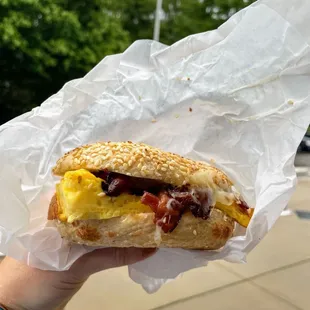 Sesame bagel with egg, cheddar and bacon